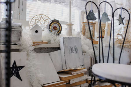 close up composition of vintage old white books, cage and clockの写真素材