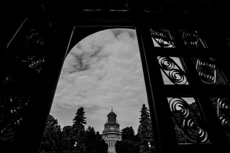 Black and white view of church between the gateの写真素材