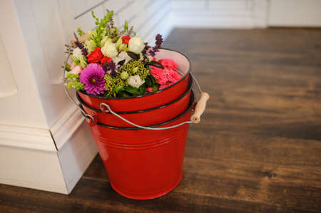 Wedding bouqet from hortensia rose and alstroemeria in red bucketの写真素材