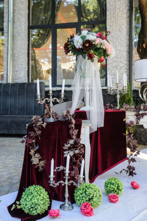 Wedding decoration. White vintage style with red / claret flowers: ranunculus, peony and hortensiaの写真素材