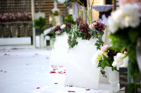 White wall for inscription on wedding decoration vintage style with red / claret flowers: ranunculus, peony and hortensiaの写真素材
