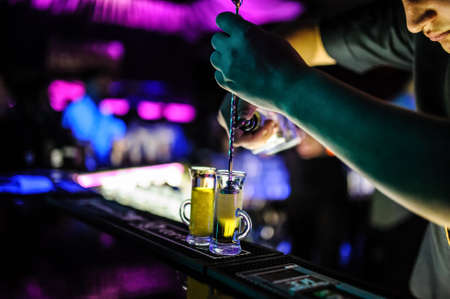 Preparation glasses with cocktails of fruit close viewの写真素材
