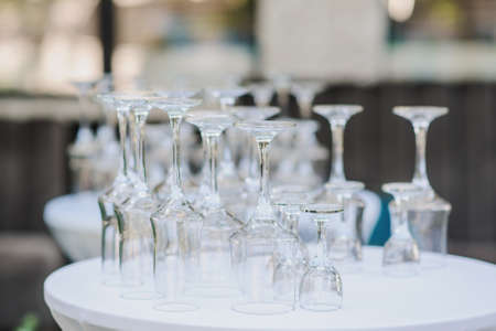 Glasses prepared for the event on the table, close viewの写真素材