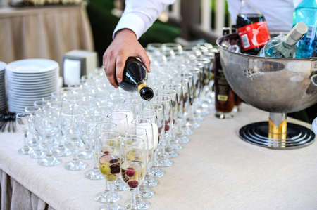 Preparation glasses with cocktails of fruit close viewの写真素材