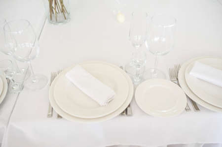White cutlery arranged on a table for a eventの写真素材