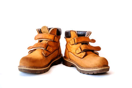 Orthopedic children boots for hiking and winter isolated on white backgroundの写真素材