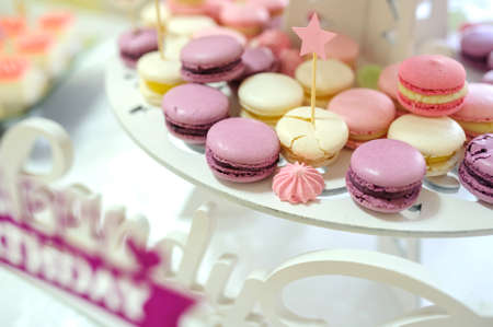 The candy bar, white, purple and pink macarons, close viewの写真素材