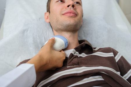 The male pacient at ultrasonography examination at the neck, close view