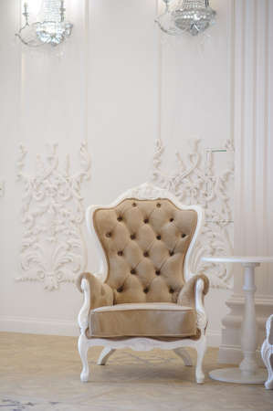 Armchair leather and wood in a banquet hall, with white and gold dominationの写真素材
