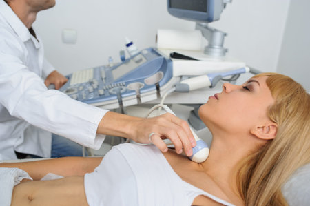 The lady pacient at ultrasonography examination at the neck, close view