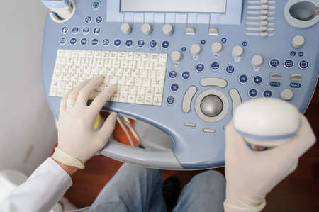 The doctor using the ultrasonography device, close viewの写真素材