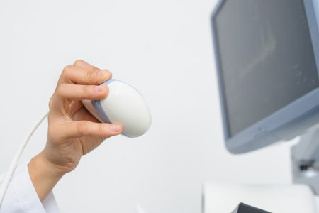 The doctor using the ultrasonography device, close view