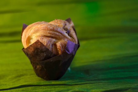 A cake on the green background, close view