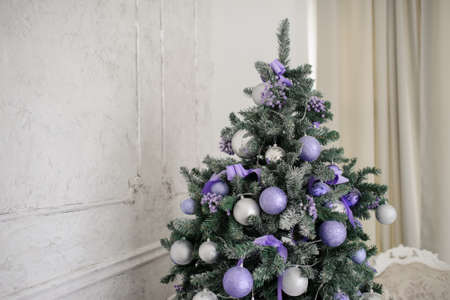 A christmas tree with purple toysの写真素材