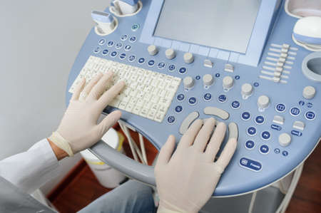 The doctor using the ultrasonography device, close viewの写真素材