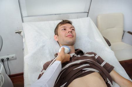 The male pacient at ultrasonography examination at the neck, close view