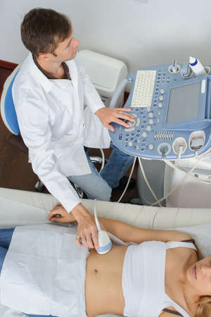 The pregnant lady pacient at ultrasonography examination, top viewの写真素材