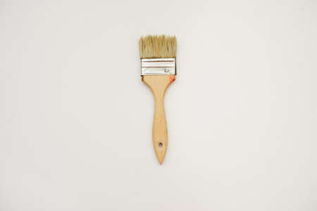 A natural wooden brush, close view, green backgroundの写真素材