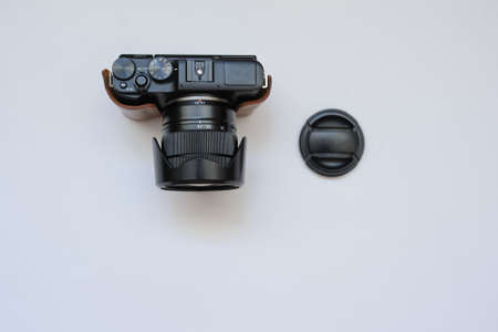 A  photo camera, close view, white backgroundの写真素材