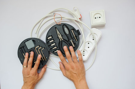 The work process of an electrician, close view, white background