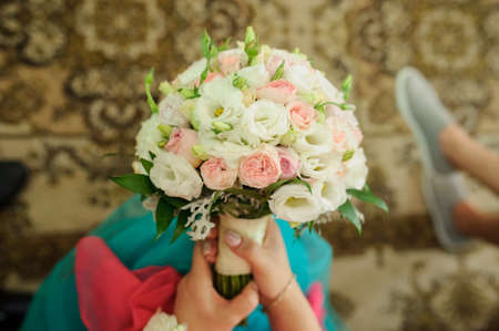 Wedding bouqet for bride in her hands. Bride holding a wedding bouqet.の写真素材