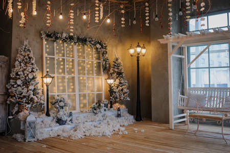 Photography studio with christmass decorations and vintage streetlampsの写真素材