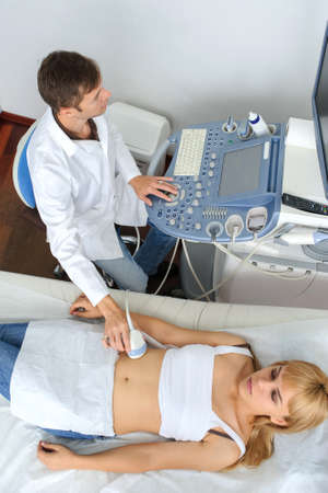 The pregnant lady pacient at ultrasonography examination, top viewの写真素材