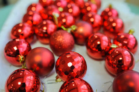 Closeup photo of red Christmas balls on a white backgroundの写真素材