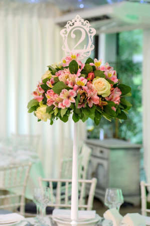 Closeup photo of vases with flowers, a part of an wedding decorationの写真素材