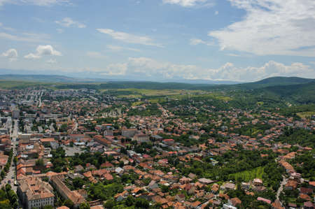 topview of a city with red roofs background.の写真素材