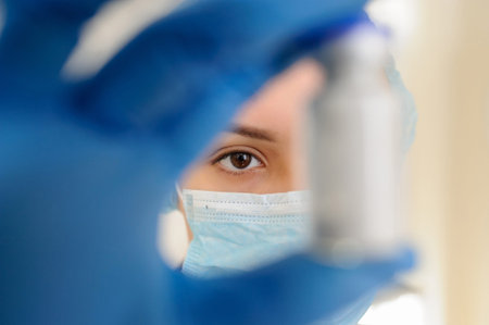 Female Doctor holding a vial of white drug powder antibiotics/ penicillin in hospital laboratory...