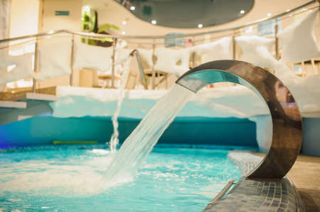 the interior of the aquazone in a spa salon, swimming pools and a water fallの写真素材