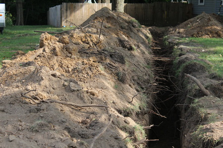 Home lawn trench, excavation,  putting in a new residential  water lineの写真素材