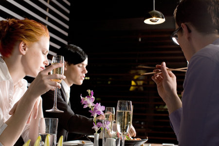A team of executives enjoying a Japanese themed lunch