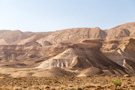 Rocky and dusty mountains in the Judaean Desert Midbar Yehuda Nature Reserve. Small Crater and Golani Trail. Breathtaking stunning landscape near the Dead Sea and Negev Desert.の写真素材