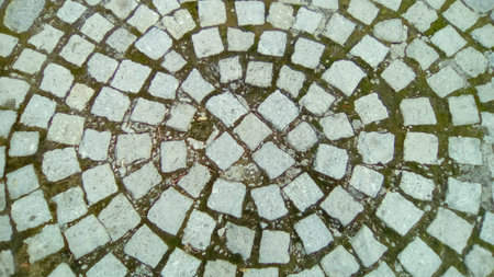 A graphic drawing of pavers in an ancient square in the old town. Background with a gray pattern....