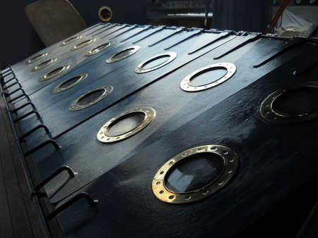 St. Petersburg, Russia - April 17, 2020, portholes on the naval ship - Aurora Museum. Symbol of the Great October Socialist Revolution. Cruiser 1st rank of the Baltic Fleet type Diana. Metal case.のeditorial素材