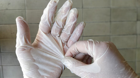 Hands in surgical gloves. Gestures, rubbing hands. Hand Wearing Medical Gloves