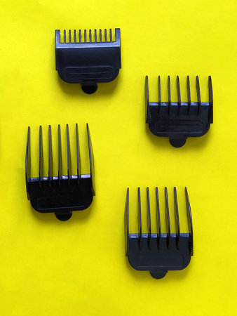 Nozzles for hair clippers. Four black plastic combs - a limiter for measuring the length of the cut...