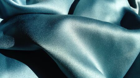 Silk of blue color. Wave Satin Glitter Fabric.の写真素材