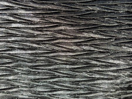 black fabric background. Abstract black woven background. Silk or satin