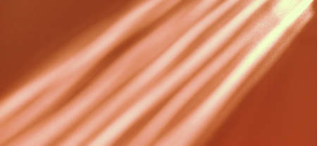 Rays on a orange background. Divine glow. Shining glow and sparks. Spotlight light. Sun symbolの写真素材