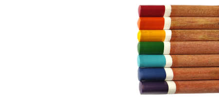 Set of wooden color pencils on a white background. Pencils on the right. LGBT symbol. Rainbow colors are arranged according to the flag of the LGBT community. Copy space. Place for text.の写真素材