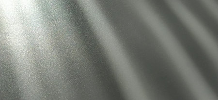 Gray striped background with oblique light effect. Play of light and shadow. Light rays. Gray and...