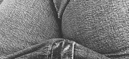 Fashionable denim pants. Details and seams on rough denim. Black and white photography.の写真素材