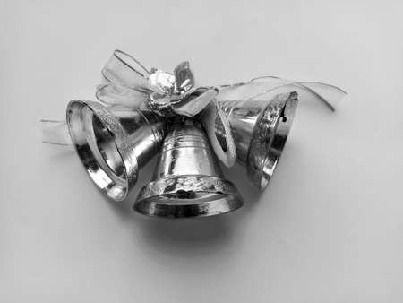 Christmas bells isolated on white background. Decoration for New Year or Christmas. Black and white monochrome photography on a light background.の写真素材