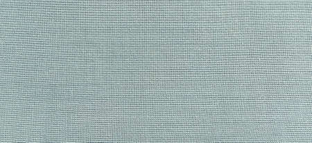 blue-green background of intertwined threads and rows. Banner. Fabric texture with uneven surface.の写真素材