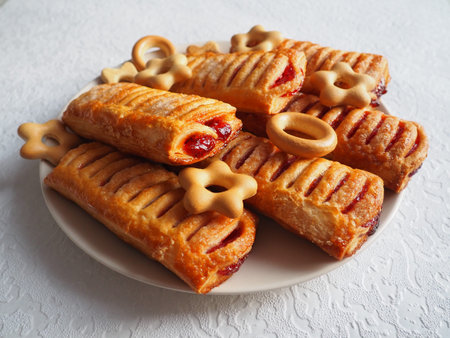 Cherry pies on a plate. Dryers and cookies