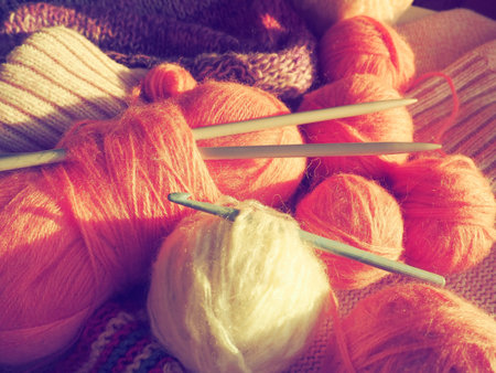 Tangles, snarls. Balls of yarn and thread, knitted clothes, knitting needles and crochet hooks....