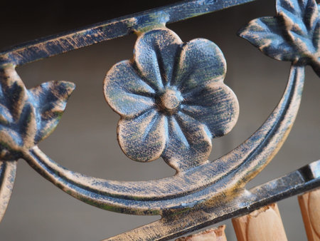 bronze flowers and curls on the fence. Kuznetsk craftsmanship. Forged decorative metal parts.